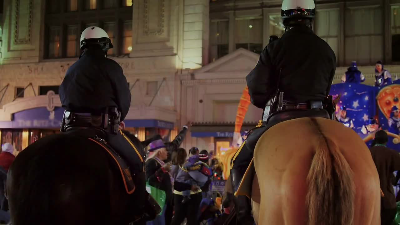 New Orleans Police Officers Watch a Mardi Gras Parade from Horseback