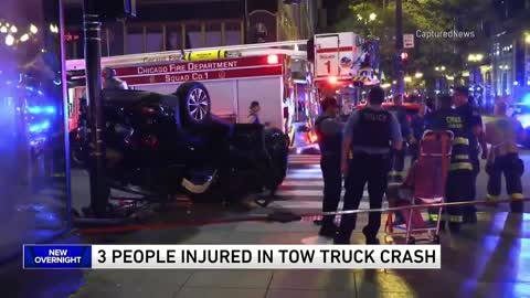 3 people injured after tow truck driver runs red light in the Loop