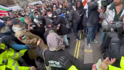 UK police hold hands to stop pro-Palestine thugs as they clash with officers