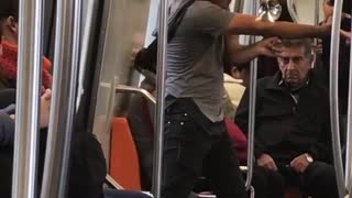 Guy on subway dancing with magic glass ball