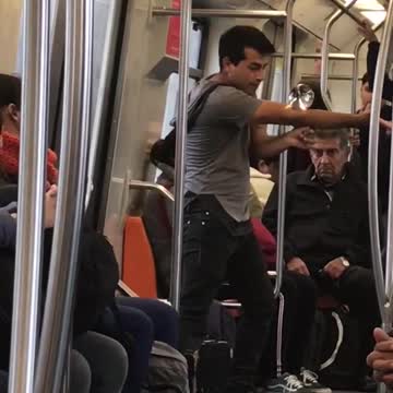 Guy on subway dancing with magic glass ball