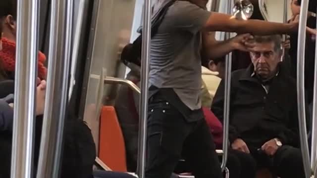 Guy on subway dancing with magic glass ball