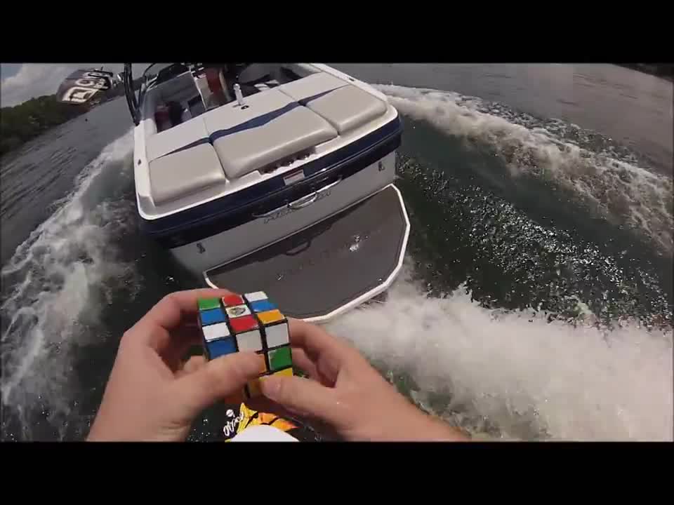 Solving a Rubik's Cube while wake surfing