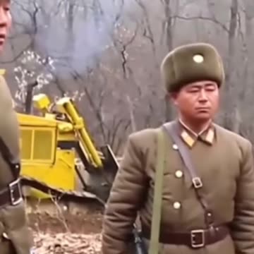 North and South Korean Soldiers Shake Hands at Border