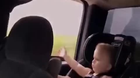 Baby sitting in car seat throws sandal out of window 👶😂