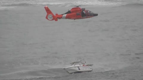 coast guards attempting a rescue operation.