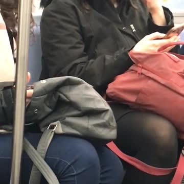 Woman smells and chews her hair on subway train