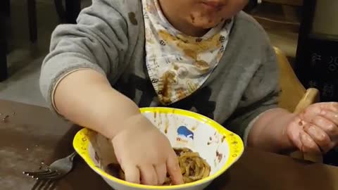 Eating child's noodles