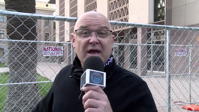 Eric Wnuck @ Arizona State Capitol. Objecting to the Fence wall.