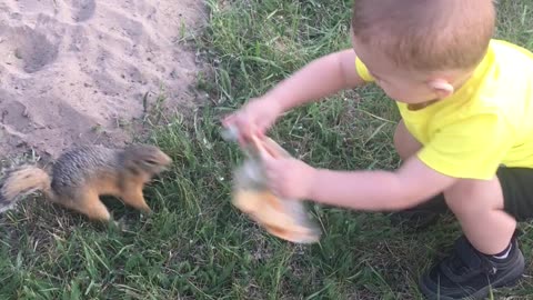 Squirrel Gratefully Takes Toddler's Pizza