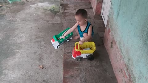 baby playing with toys and roll all over the paint