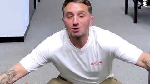 Carrie Bickmore and Tommy Little try to swing sausage in their mouth