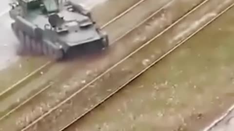 Tank drives over civilian car