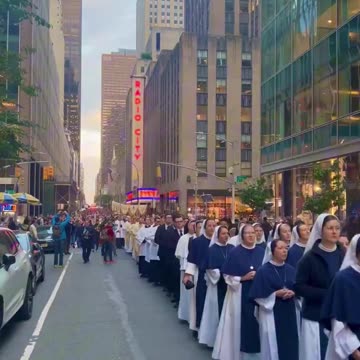 More than 5,000 Catholics walked down the streets of New York City praying and singing for peace.