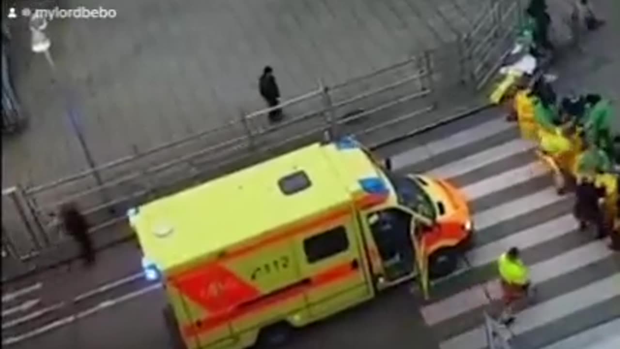 Climate change activists refuse to allow an ambulance to pass