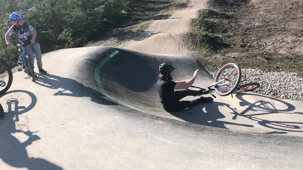 A Biker Crashes Landing Front Wheel