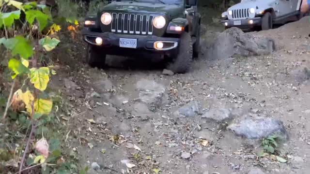 A big rock in the middle of the road