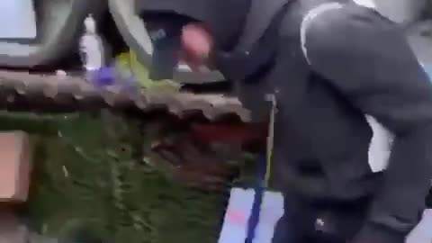 Ukronazi stomping flowers placed by Germans near Russian tank in Berlin