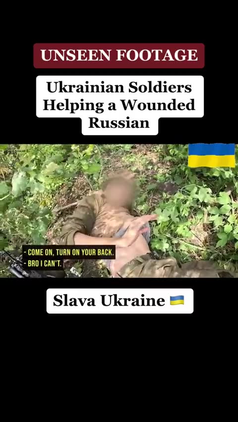 A Ukrainian soldier helps a wounded Russian who surrendered voluntarily