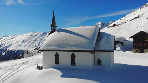 A Drone Shot of a Church in Belalp