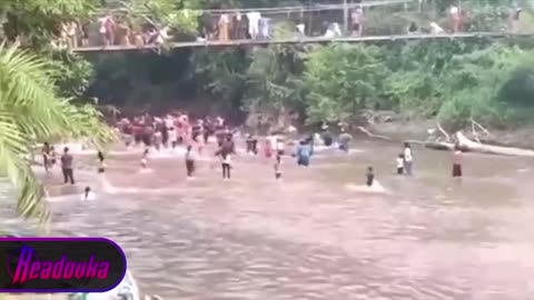 Suspension bridge collapses during duck fishing competition in Indonesia