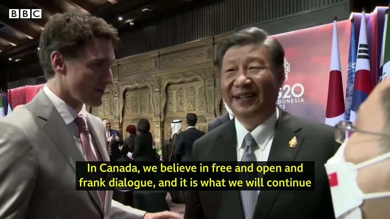 China and Canada leaders caught having tense exchange on camera - BBC News