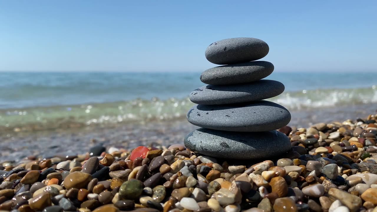 "Harmonious Rock Balancing: Nature's Sculptural Symphony of Stacked Stones"