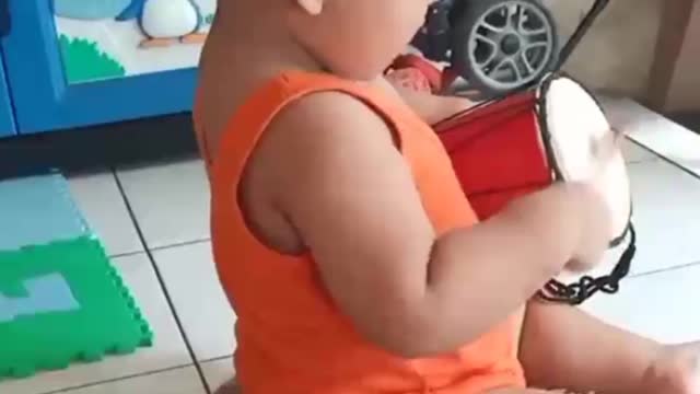 Baby playing drum