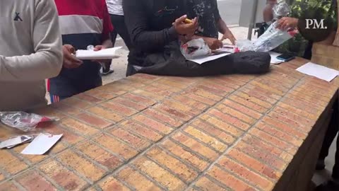 Illegals opens their packages after being processed