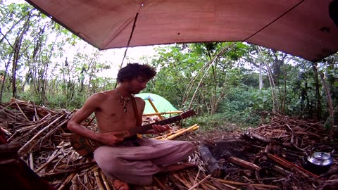 Sofus plays guitar at Rainbow Gathering 2012 in Coban, Guatamela