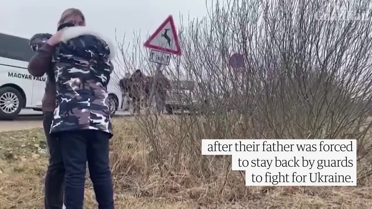 Ukrainian mother hugs her children brought to safety by a stranger