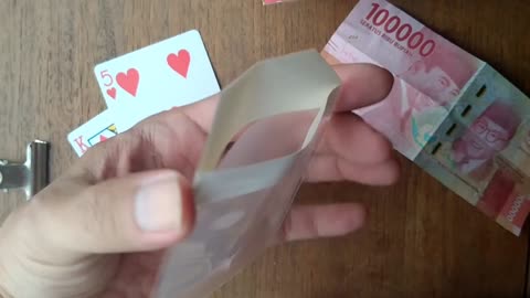 BY MAGICING EMPTY TRANSPARENT ENVELOPES TO APPEAR MONEY!!