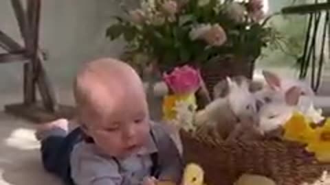 Little baby playing with duck
