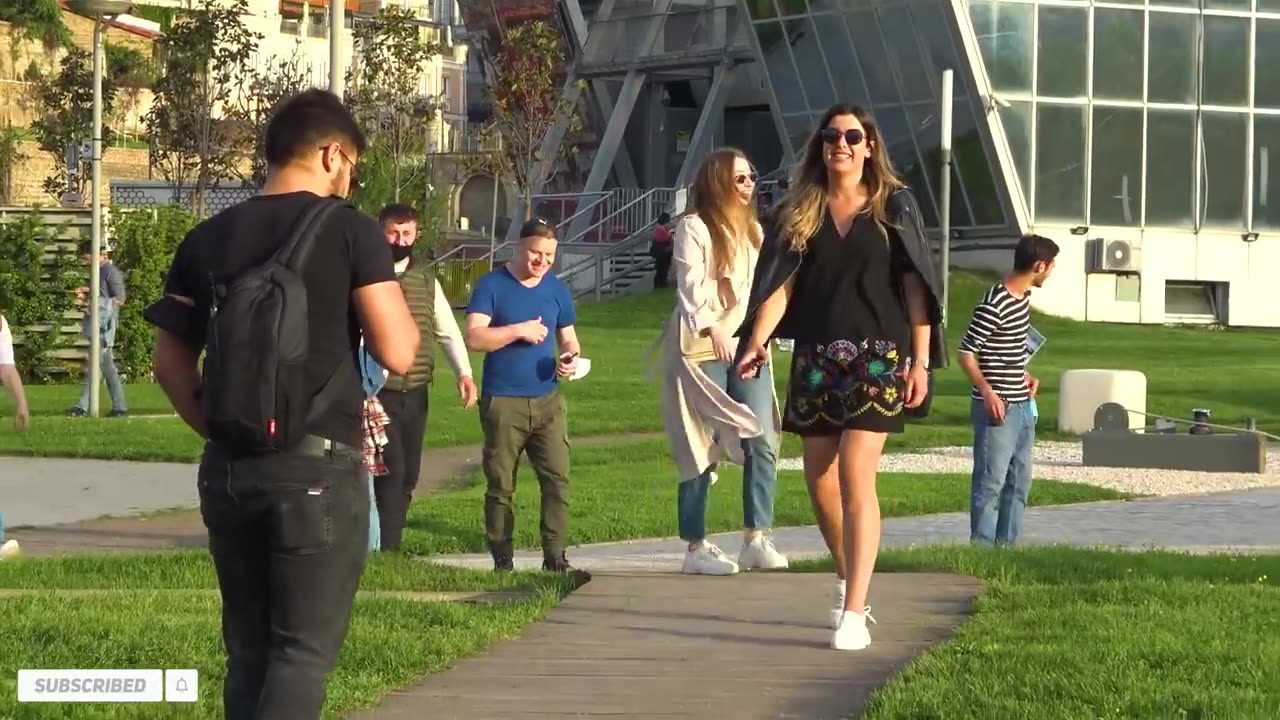 Crazy guy on street with cute girls