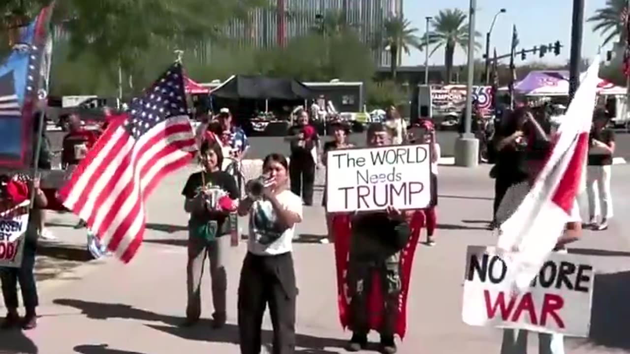 Japanese Americans for Donald Trump play the National Anthem outside his Las Vegas rally