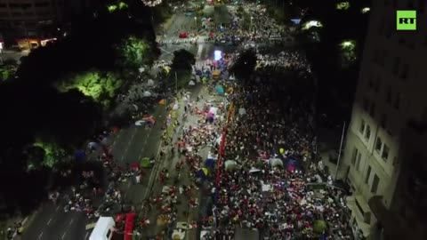 Demonstrators hit streets of Buenos Aires to protest welfare cuts demanded by IMF