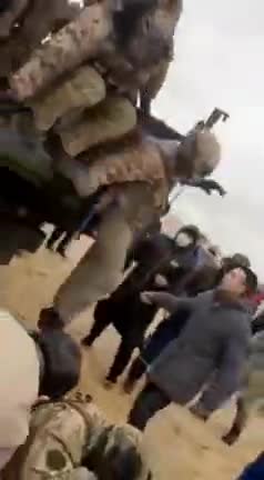 NOW - Citizens in Kazakhstan detain some military personnel as violent anti-government