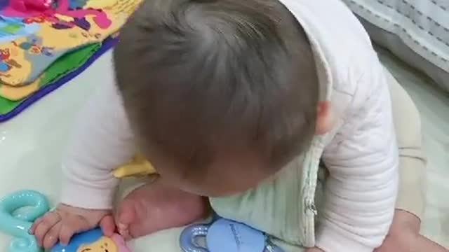 7 month baby playing with toys