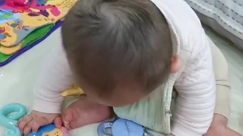 7 month baby playing with toys