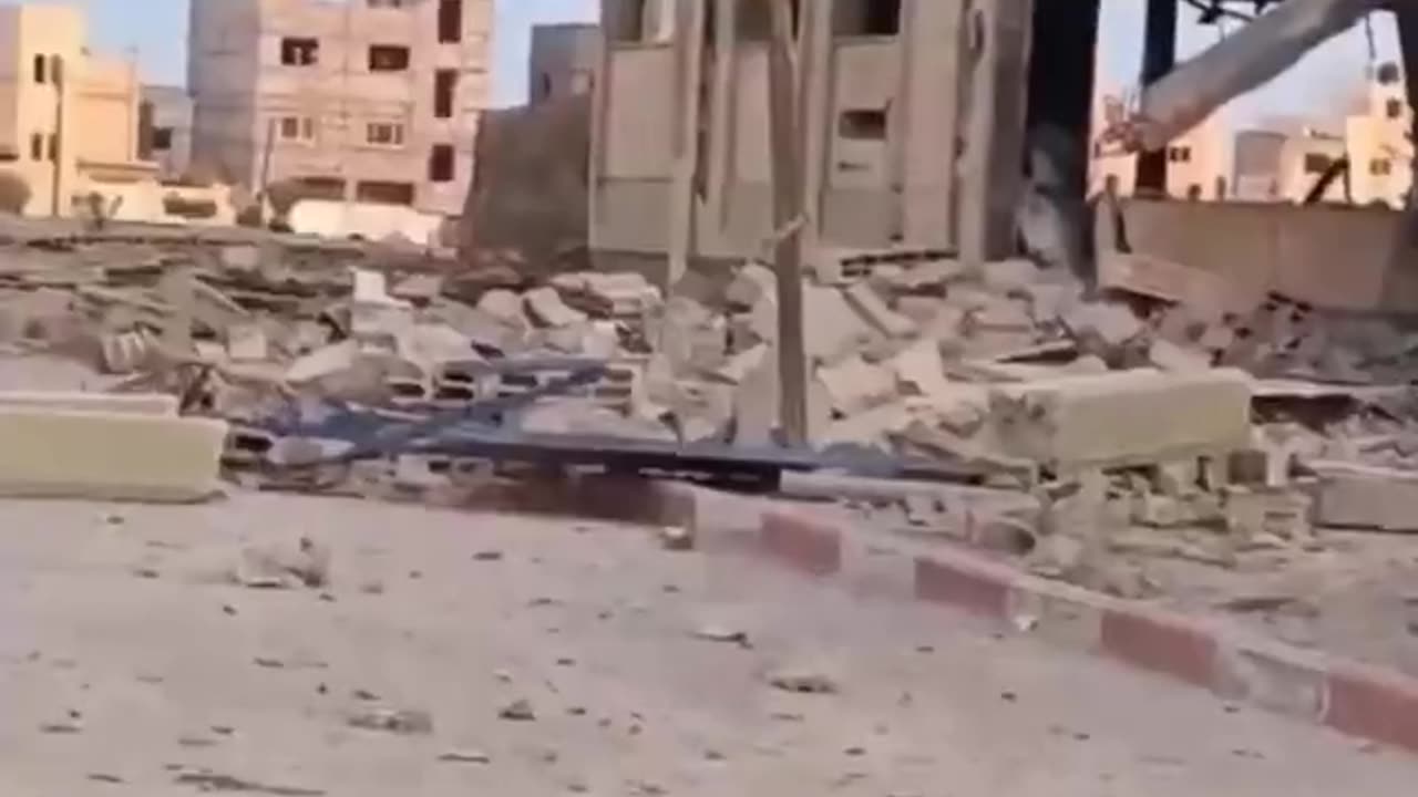 Hamas inspects a mosque destroyed by Israeli airstrikes in the Gaza Strip