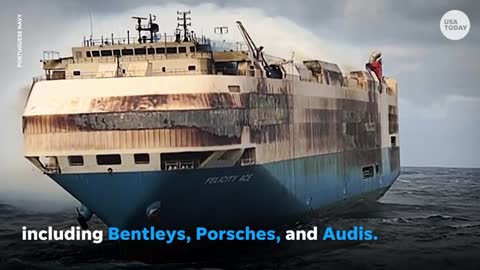 LUXURY cars stranded on burning cargo ship