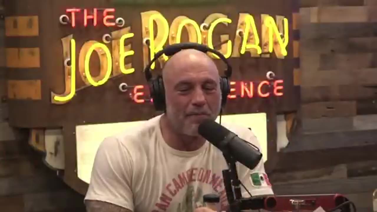 Joe Rogan on President Biden with a huge smile on his face while meeting with Donald Trump