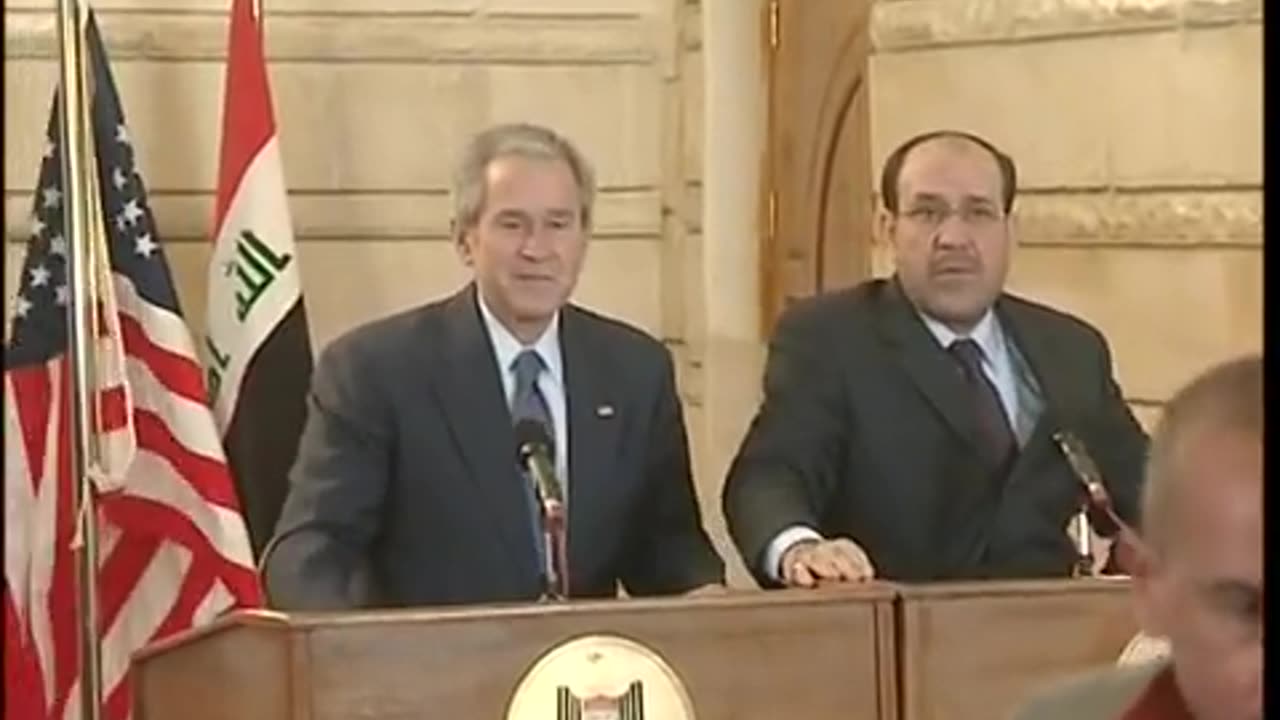 George W. Bush dodges flying shoes