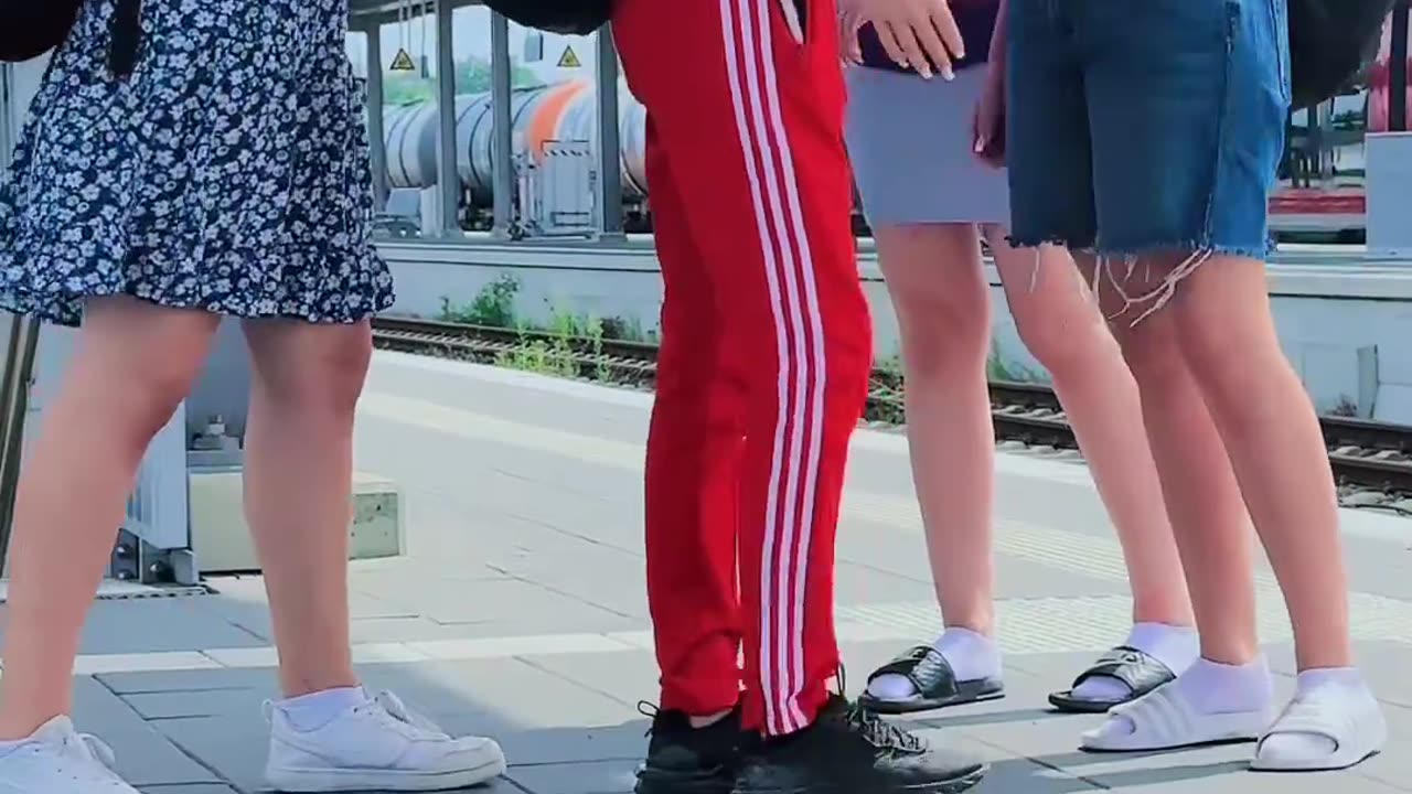 German girls are coming back from school, Afghan immigrants are filming