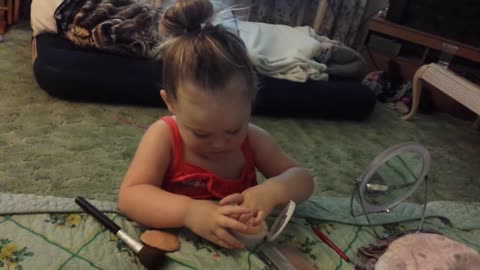 Toddler doing make up