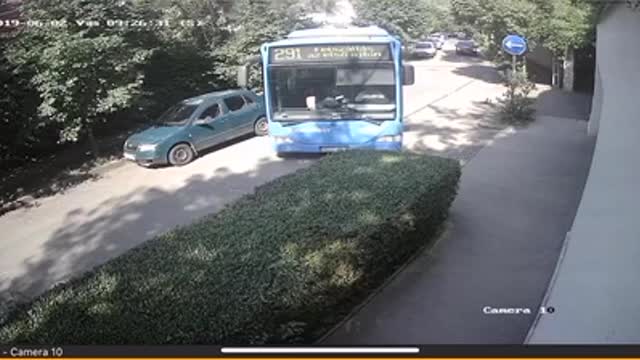 Bus Tries to Turn Into Lane but Runs Into Bushes and Fire Hydrant