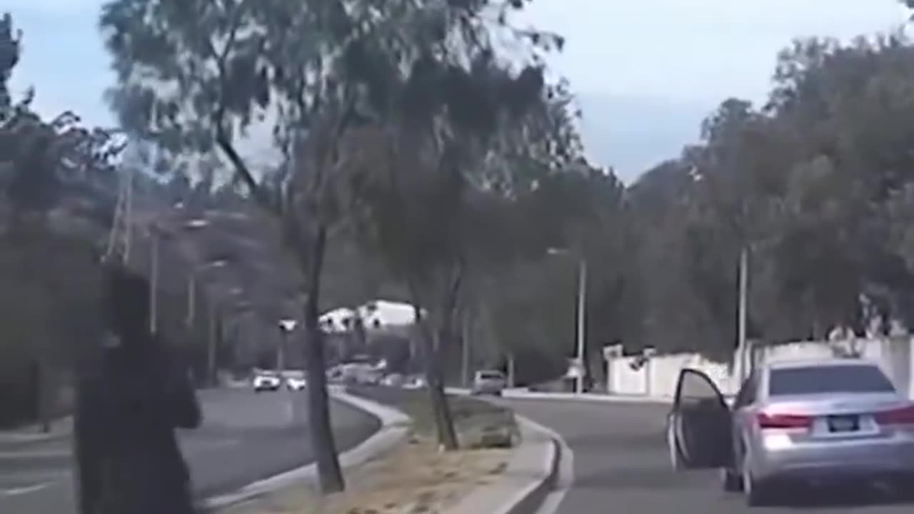 Woman Gets Out Of Car And Lets It Idle Into Traffic