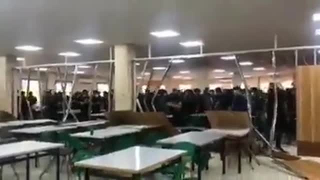 Iranian university students tear down wall separating men and women in dining hall