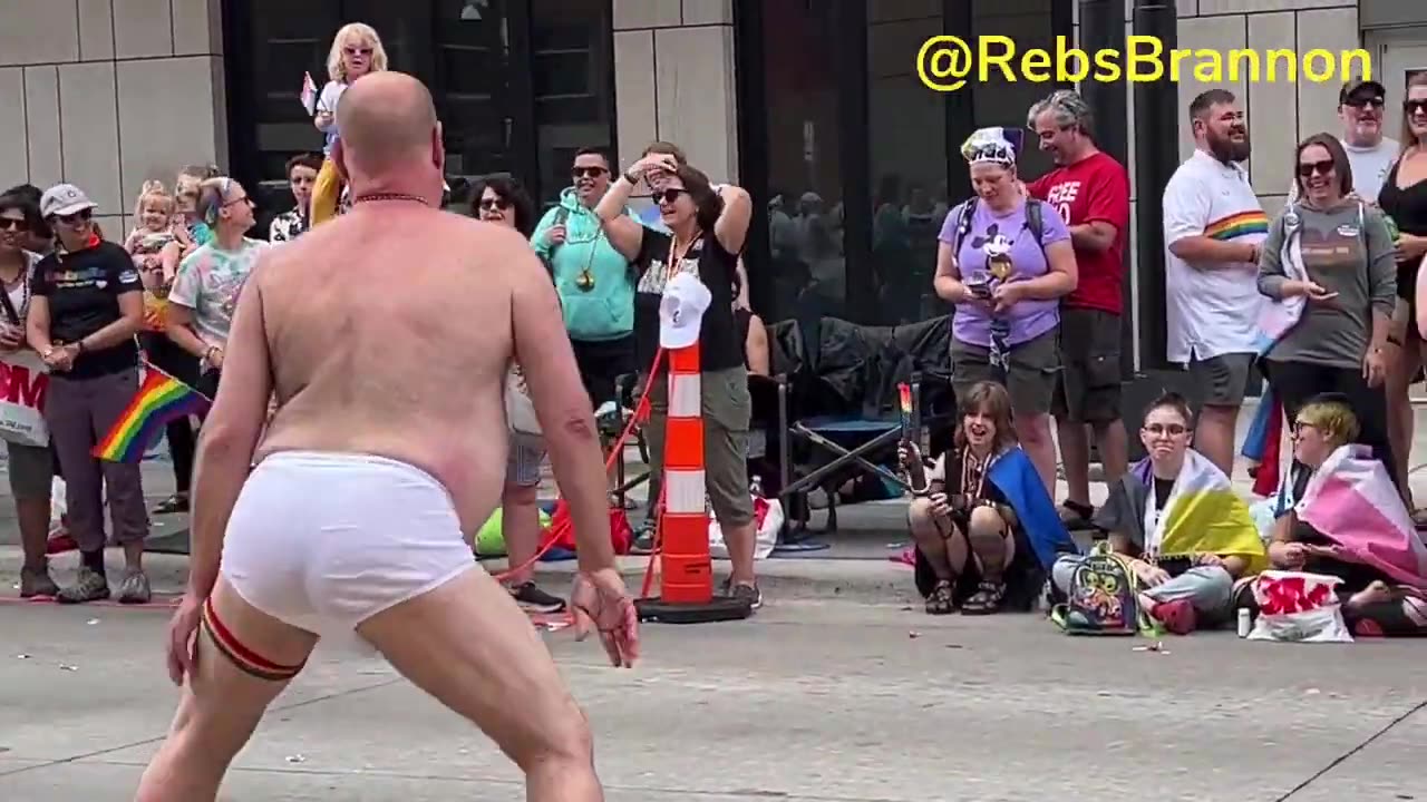 Gay man twerking in front of children at Pride Parade