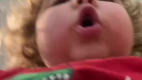 Cute baby girl singing I need your lob.